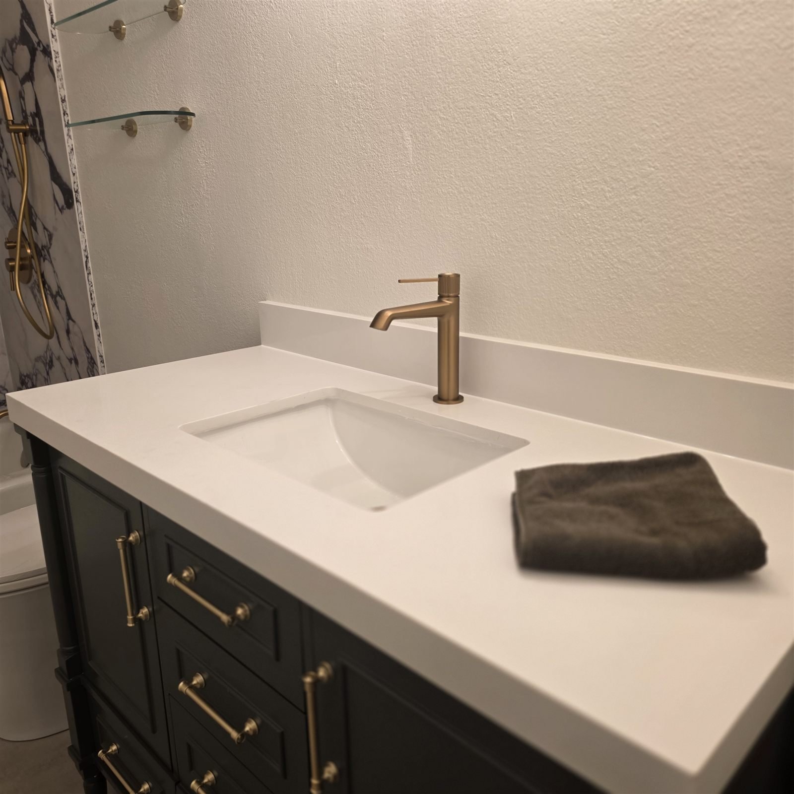 Custom vanity with brass faucet