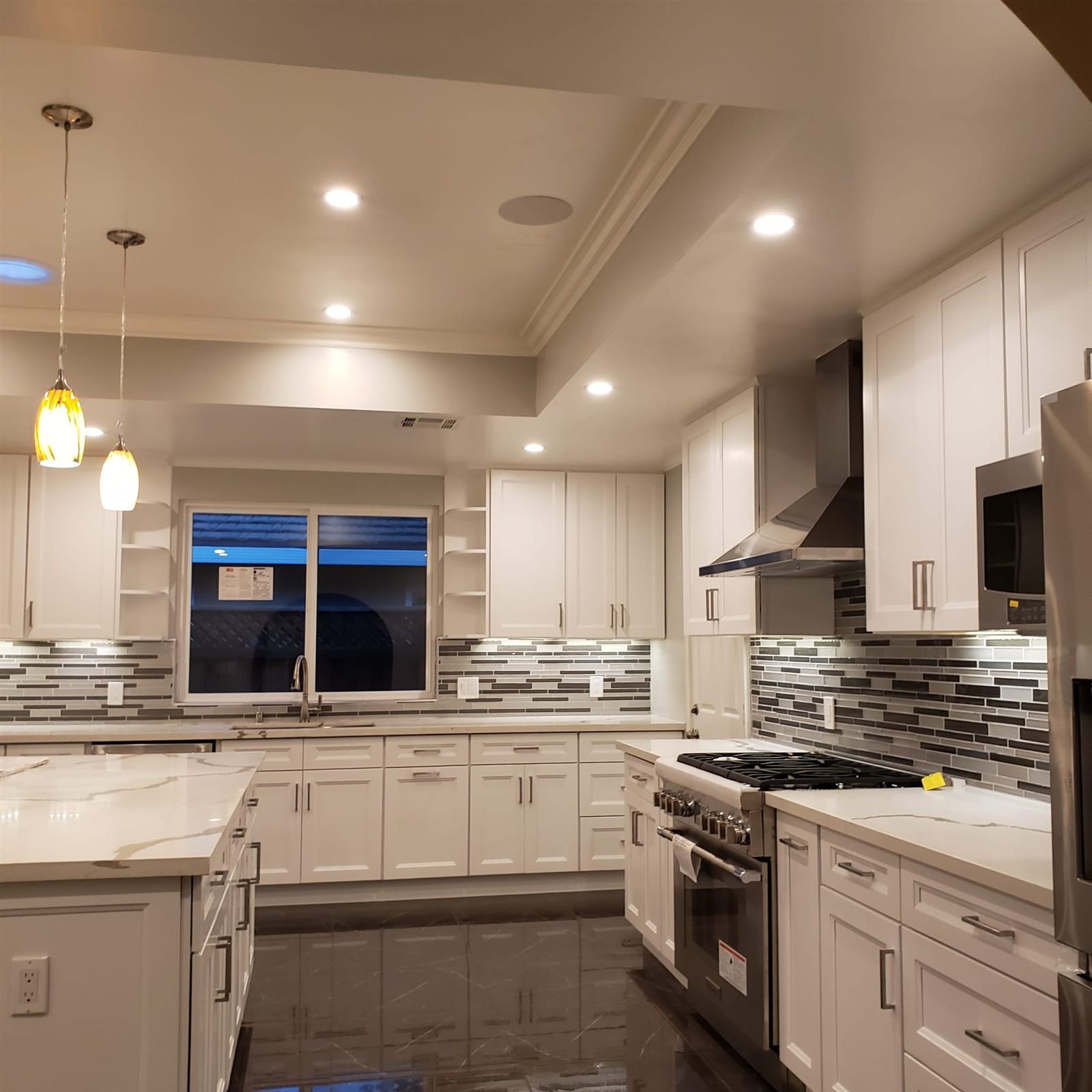 White kitchen with marble counters