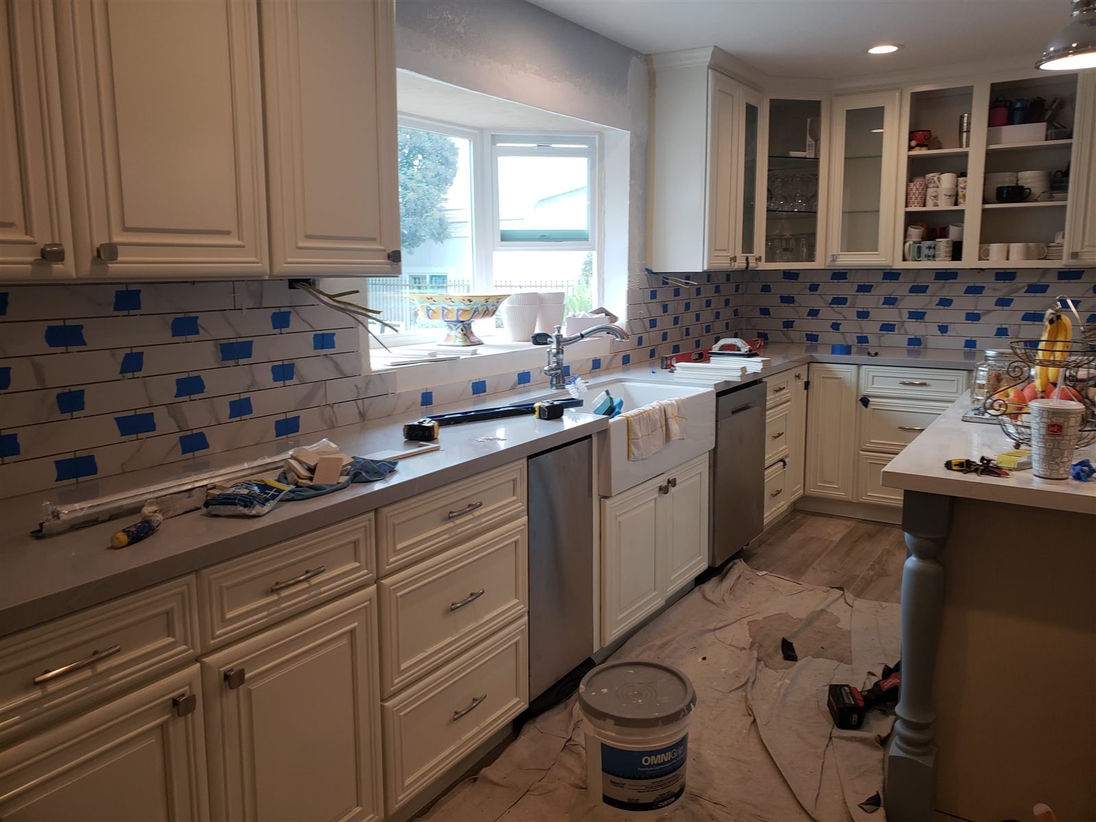 Marble subway tile backsplash installation